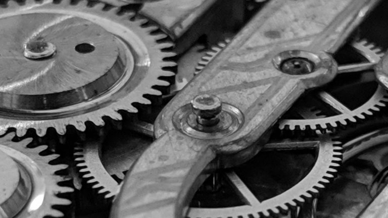 Close-up of the cogs and gear wheels inside a watch