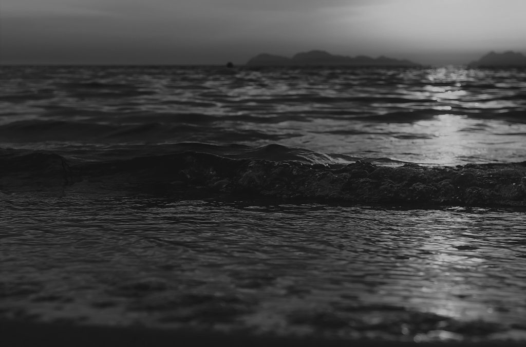 Waves on the shore at sunset